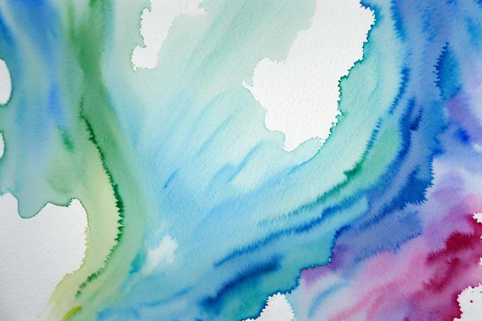 Blaue und grüne Aquarellfarbe verläuft wunderschön auf nassem Papier.